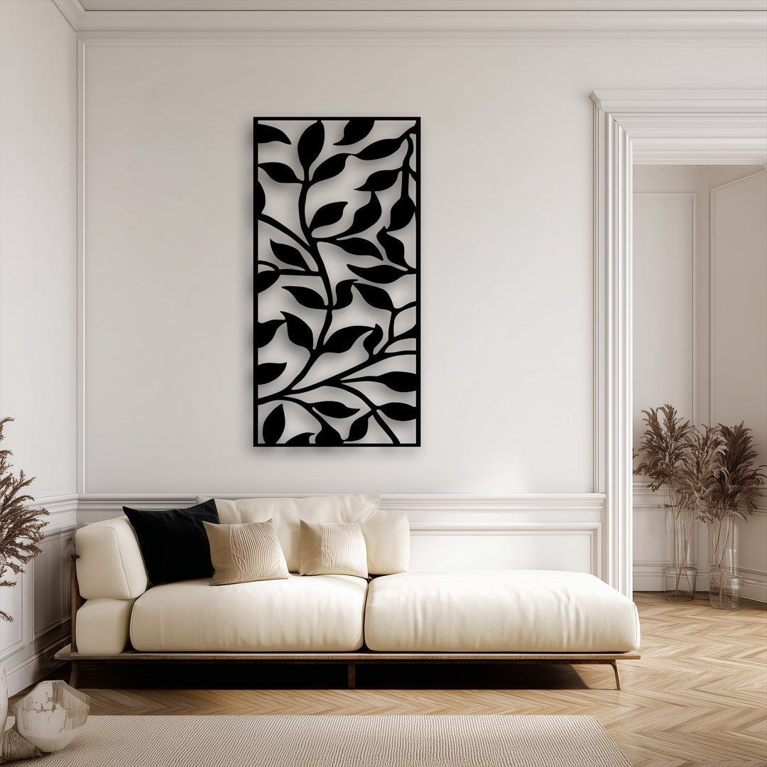 A prominent vertical rectangular metal artwork displays an abstract leaf branch pattern, embodying modern botanical design.