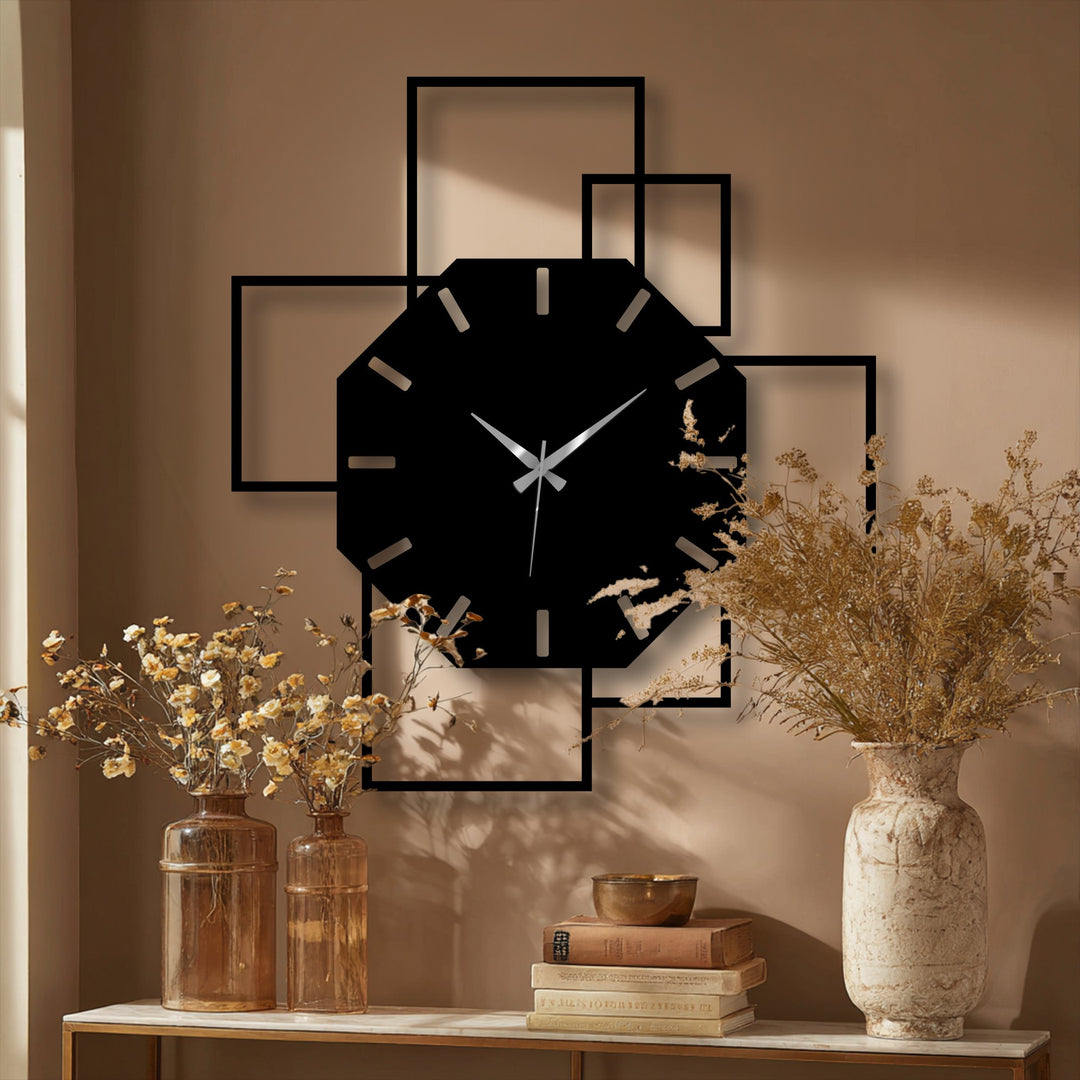 Black dominates this octagonal geometric wall clock composed of decorative metal art with a modern square frame design against a tan backdrop.