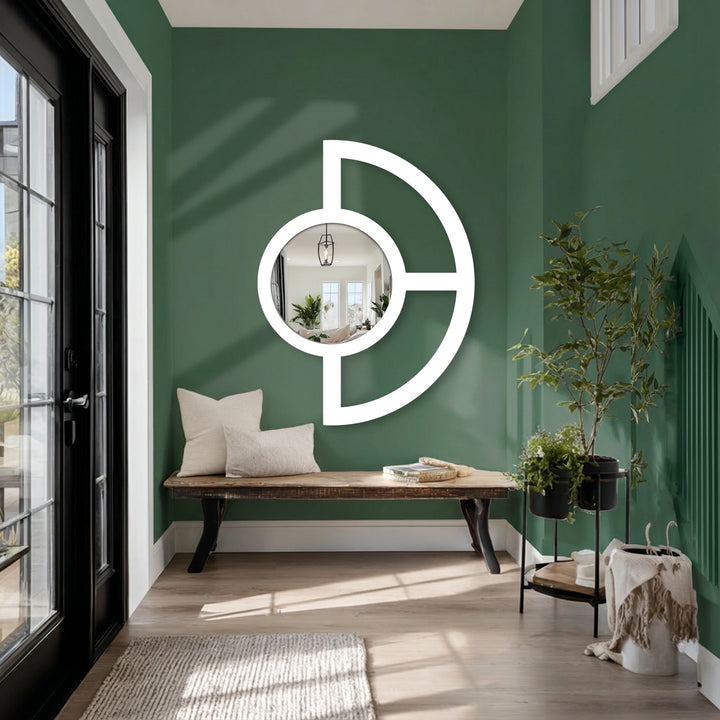 Emphasizing organic forms, this framed wall mirror features a striking half-circle design that mimics nature's curves to create a modern, balanced aesthetic.