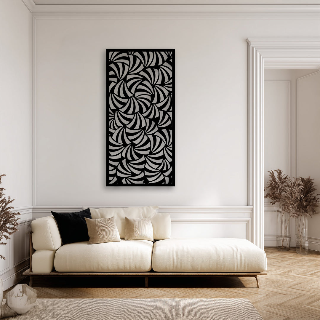 The crisp, dark border of the abstract spiral metal art for wall sharply defines its intricate geometric pattern against the bright white wall.