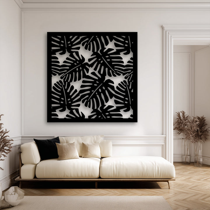 The sharp, clean edges and bold black borders perfectly frame the unique metal wall art with its modern tropical Monstera Leaf Pattern.