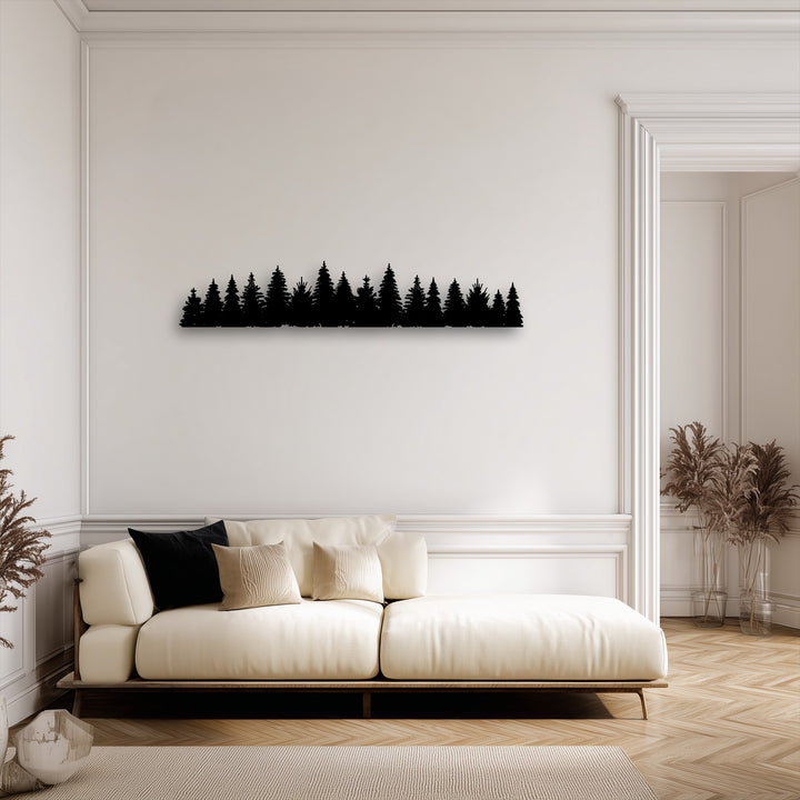 The clean, dark edges of the pine forest silhouette decorative metal art contrast with elegant white wall and door borders.