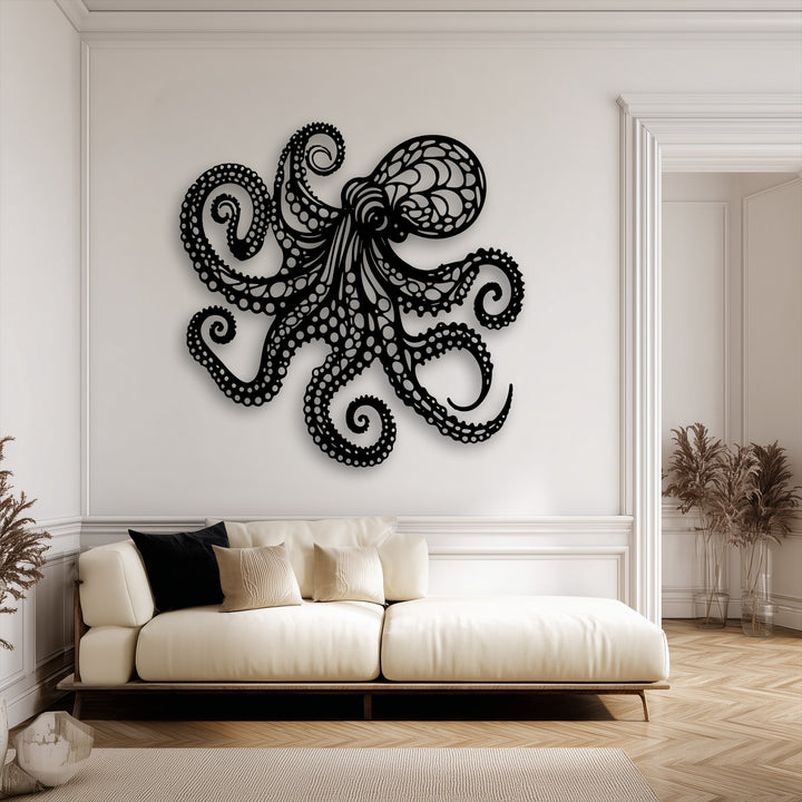 The striking focal point is a large, black, stylized octopus unique metal wall art, with intricate tentacles detailed on a clean white wall.