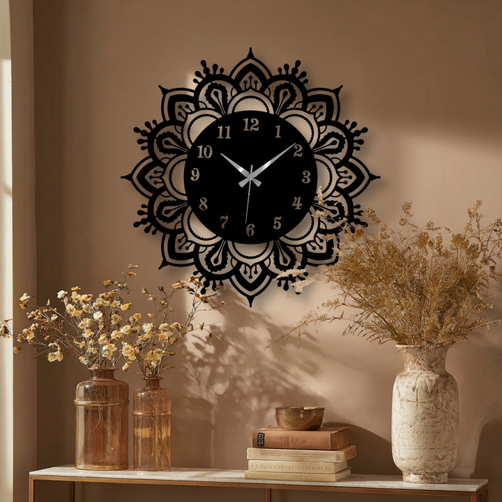 Brightest point on the decorative mandala design draws focus to the elegant classic design of this ornate metal wall decor clock.