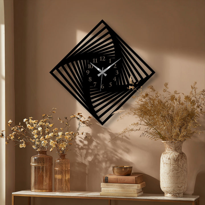 The darkest area features a striking black twisted square decorative metal art clock with a modern optical design and silver hands.