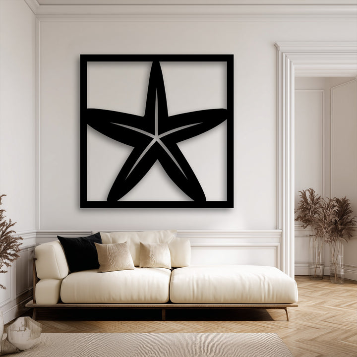 The striking transition from the stark black unique metal wall art featuring a starfish to the creamy white wall, creating soft gray shadows.