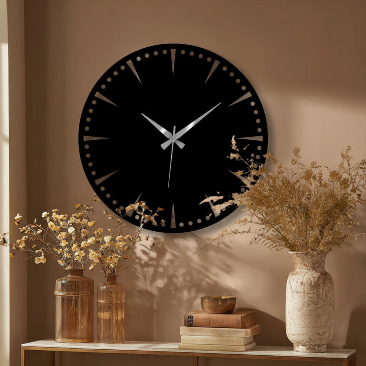 Circular black minimalist statement wall clock showcases its geometric elements with radial lines, creating a striking metal wall decor.