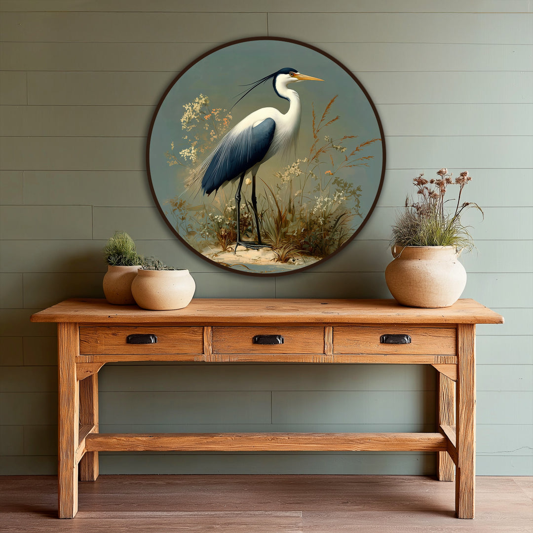 High color contrast highlights the elegant heron in this round, nature-themed modern oil painting art with sage tones and a handcrafted aesthetic.