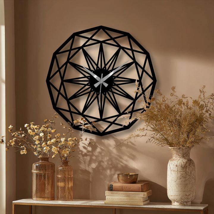 Light and shadow play across the geometric star pattern metal art for wall clock, highlighting its intricate, angular design on the subtly textured wall.