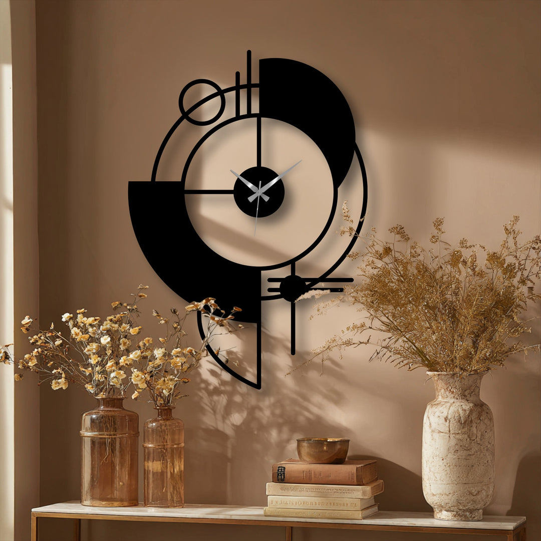Juxtaposing the clock's metal artwork and sharp lines, the surrounding organic forms and dried botanical arrangements soften the overall aesthetic.