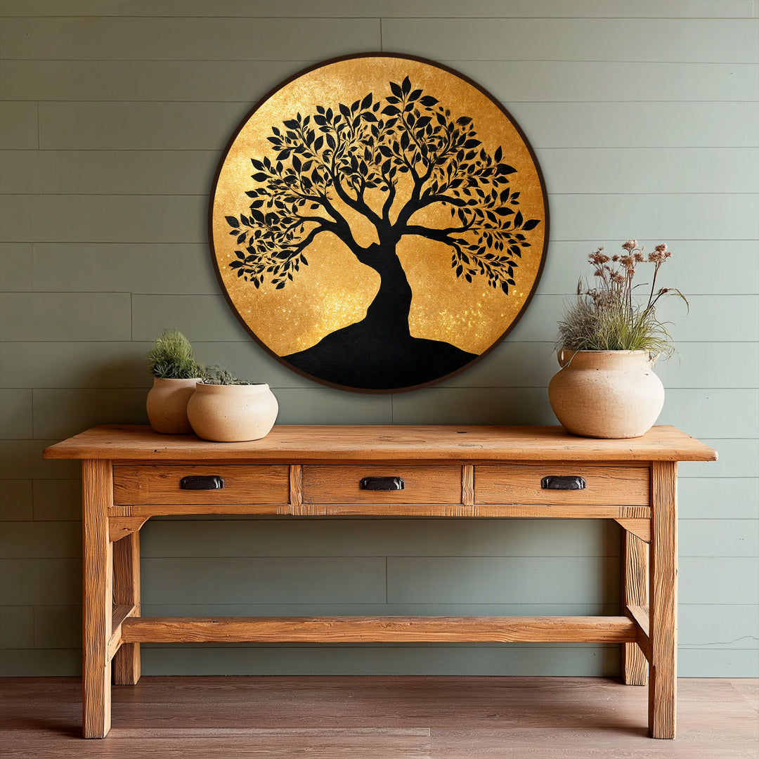 Showcasing the elegant silhouette round oil painting decoration, the dark border frames a radiant golden canvas featuring a majestic tree with intricate branches and dark contrasting colors.