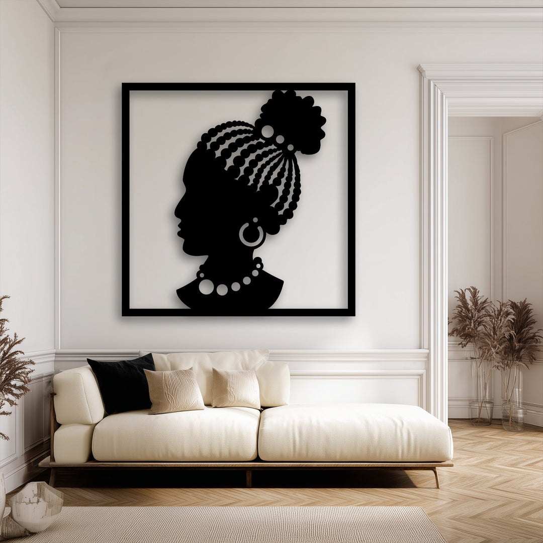 The stillness of the elegant African woman silhouette in this decorative metal art piece brings a serene cultural focal point to a modern, calm interior.
