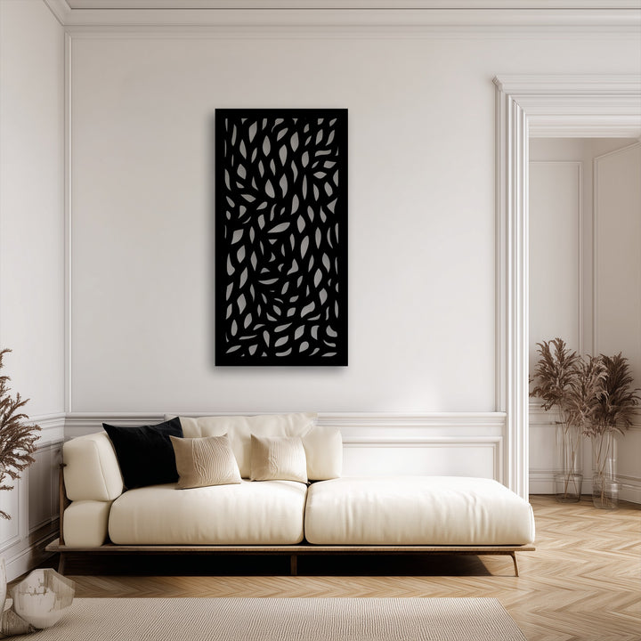 A dynamic sense of movement flows across the black abstract leaf pattern metal art for wall, with scattered leaf shapes creating a lively rhythm.