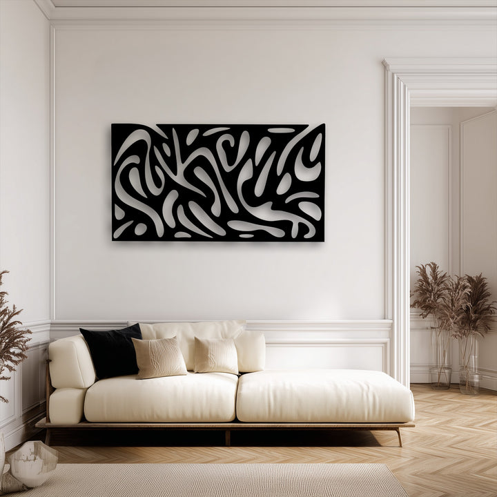 A striking piece of decorative metal art featuring an abstract fluid pattern is prominently displayed above a contemporary cream sofa, enhancing the modern panel decor.