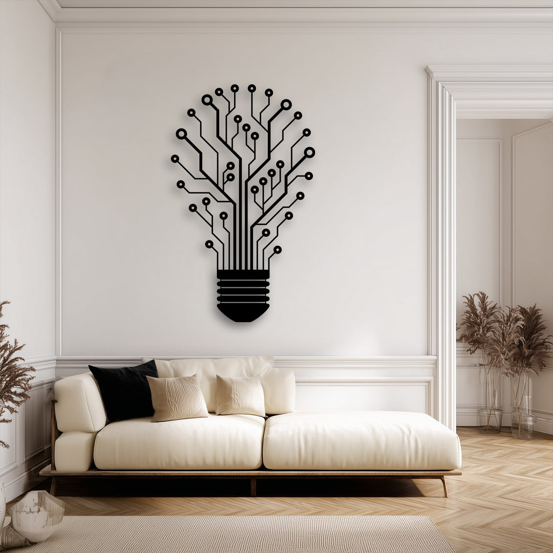 The dimensional layering effect of the black Tech Tree Lightbulb metal art for wall is accentuated by its shadow on the white wall, showcasing innovative design.