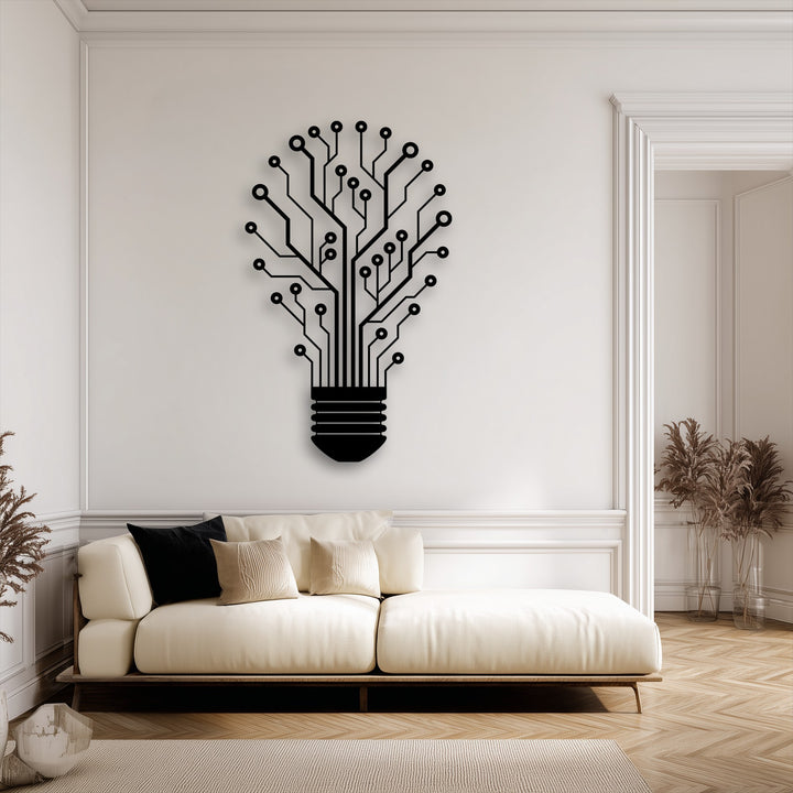 The dimensional layering effect of the black Tech Tree Lightbulb metal art for wall is accentuated by its shadow on the white wall, showcasing innovative design.
