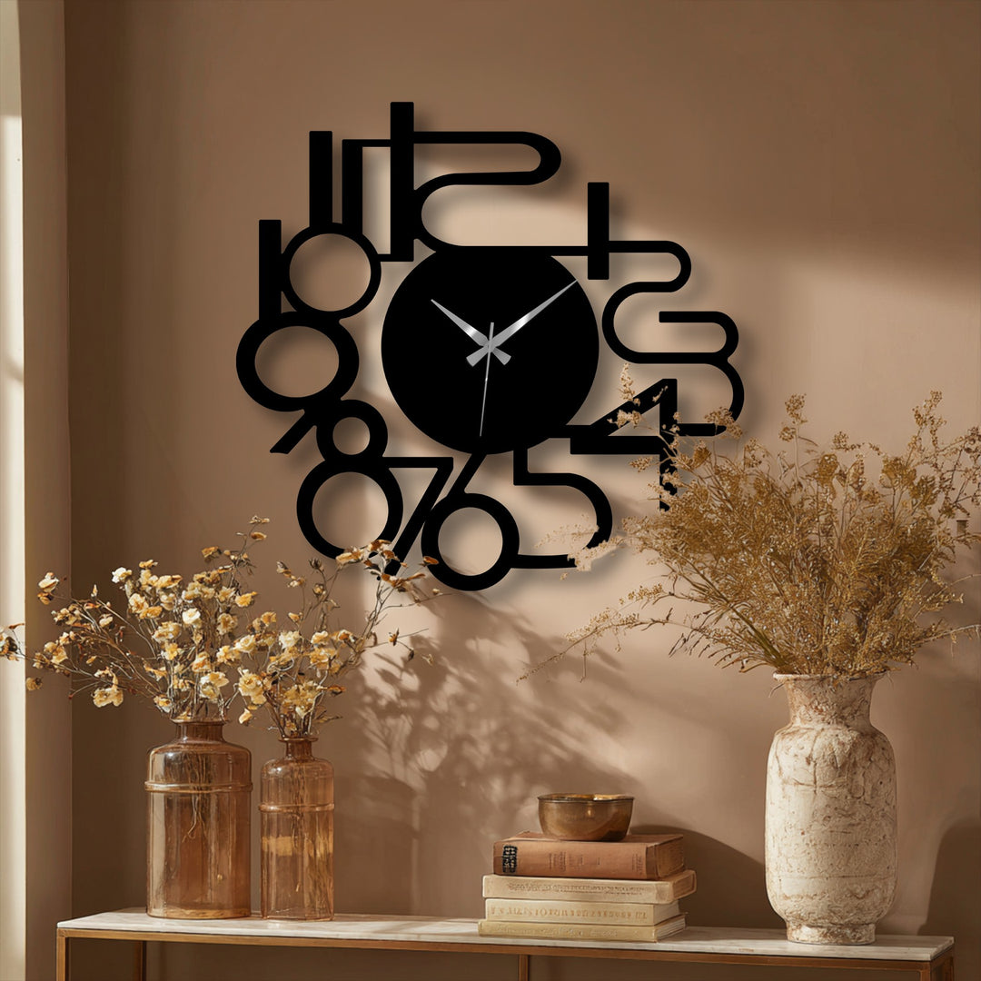 The layered, dimensional design of the abstract numbers on this metal artwork wall clock creates deep, contrasting shadows against the wall.