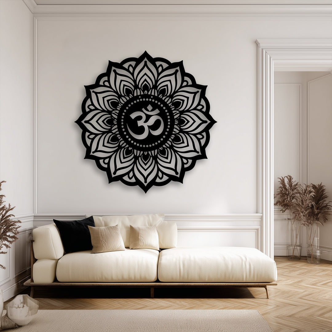 The dramatic transition from the stark black unique metal wall art to the light, warm wall beautifully highlights the intricate Sacred Om Mandala design.