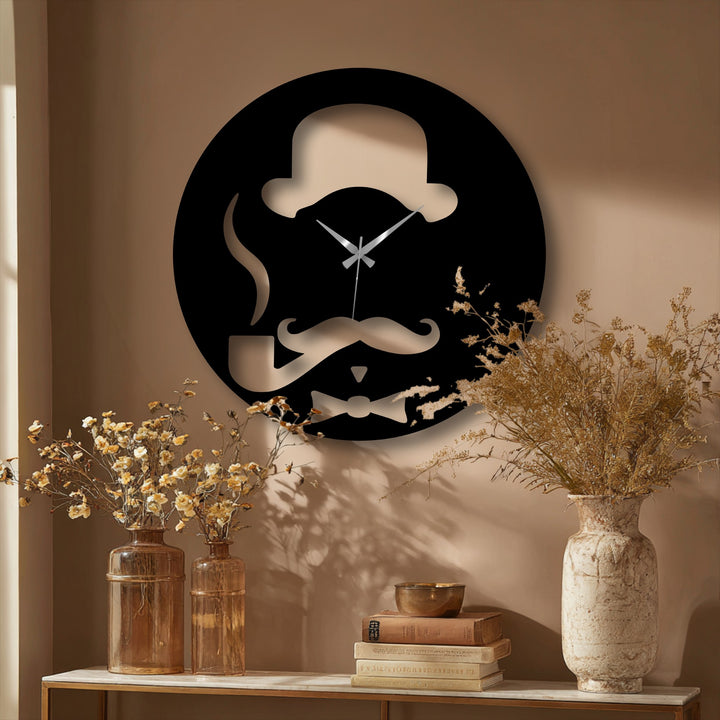 Showcasing abstract quality, this unique metal wall art clock features a minimalist gentleman's silhouette with a hat, pipe, and bow tie.