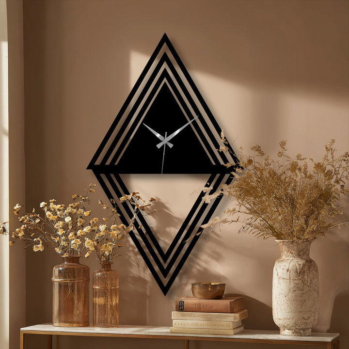 Evoking the abstract quality, the geometric diamond wall clock's layered design showcases compelling metal artwork with its triangular shapes and contemporary flair.