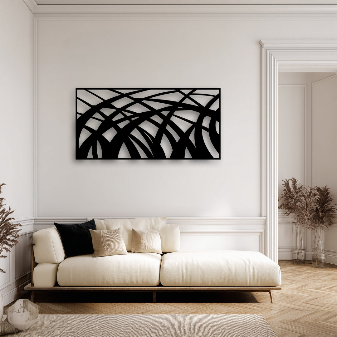 The sleek matte black finish of the abstract flowing lines metal wall decor highlights the modern geometric wave panel.