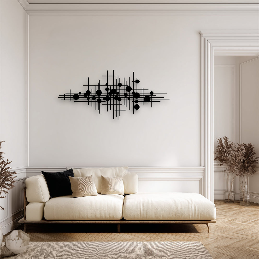 A pristine cream-colored wall with classic moldings and an open doorway provides an elegant backdrop for the striking metal art for wall.