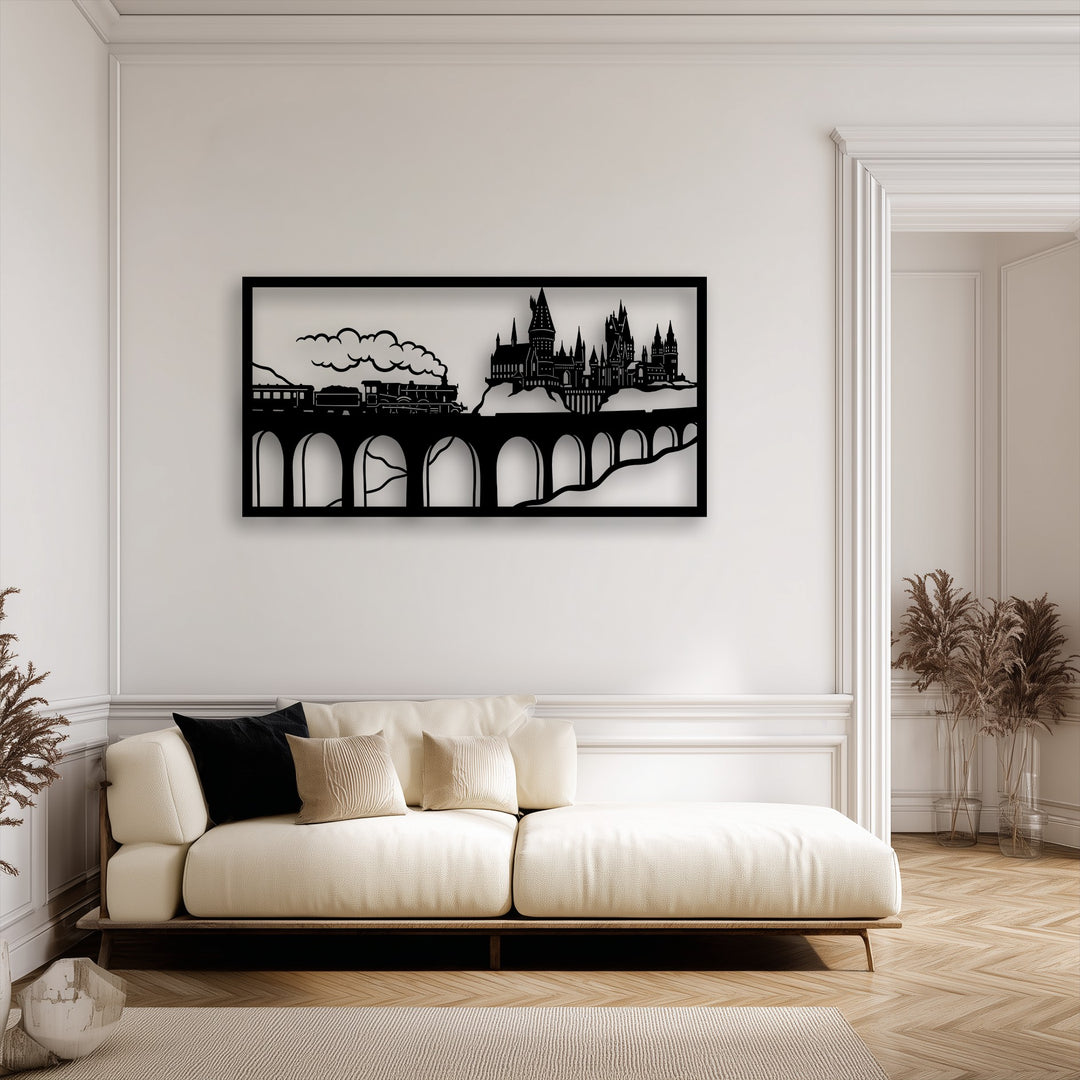 A cream textured sofa with black and beige cushions rests on a beige rug, complementing the dark Wizard Castle Train Scene metal art for wall.