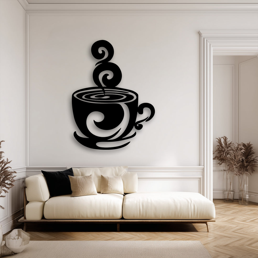 The smooth, matte black surface texture of the swirling coffee cup decorative metal art stands out against the subtly textured white wall.