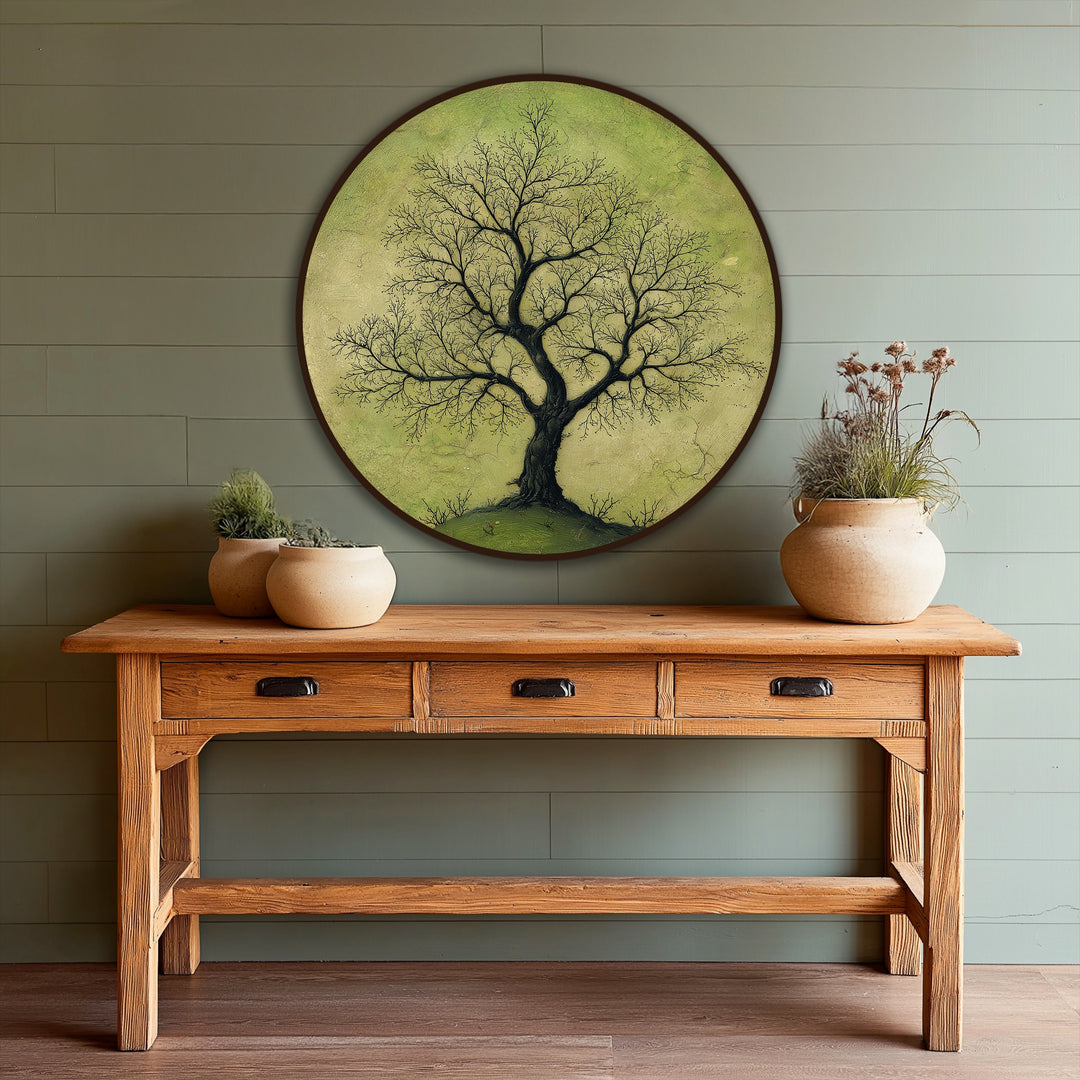 Layers of the solitary branching tree on a soft green ground in this round nature-inspired oil painting artwork enhance depth and visual interest.