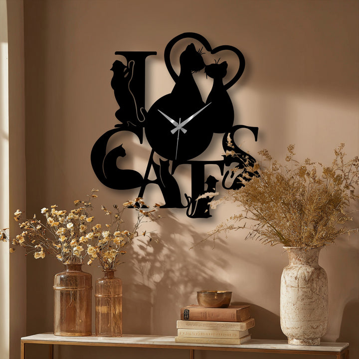 The abstract design of this Love Cats metal artwork clock skillfully uses silhouetted felines to convey romance.