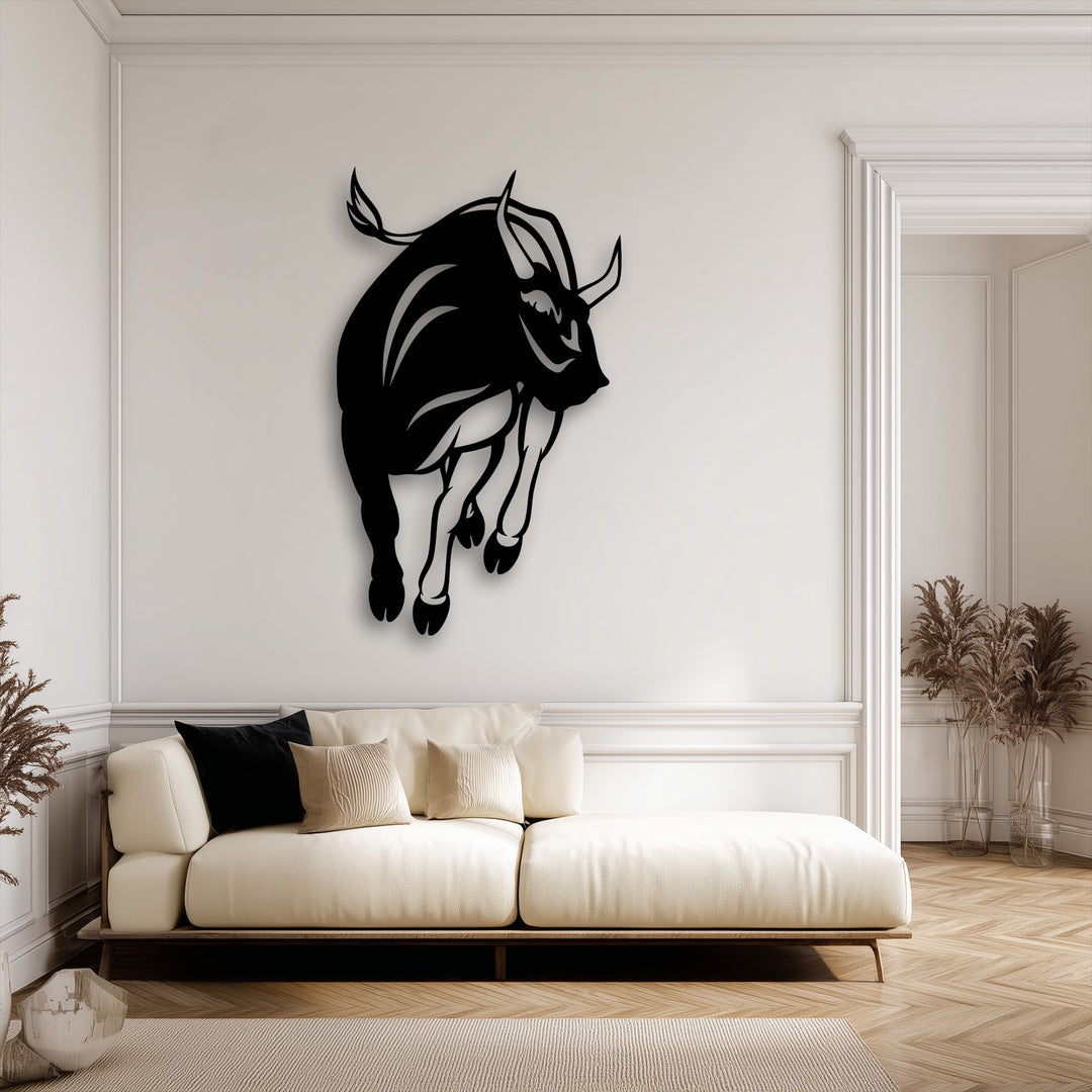 Geometric elements define the powerful Charging Bull Silhouette metal artwork, showcasing dynamic angles and bold curves against a neutral wall.