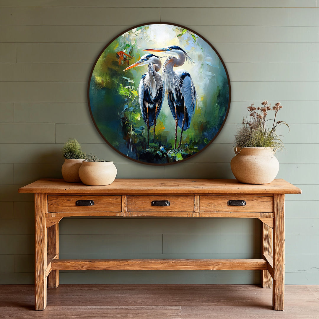 Backlit area highlights the exquisite details of the heron pair in this round oil painting artwork, showcasing a unique rendition of wildlife in nature.