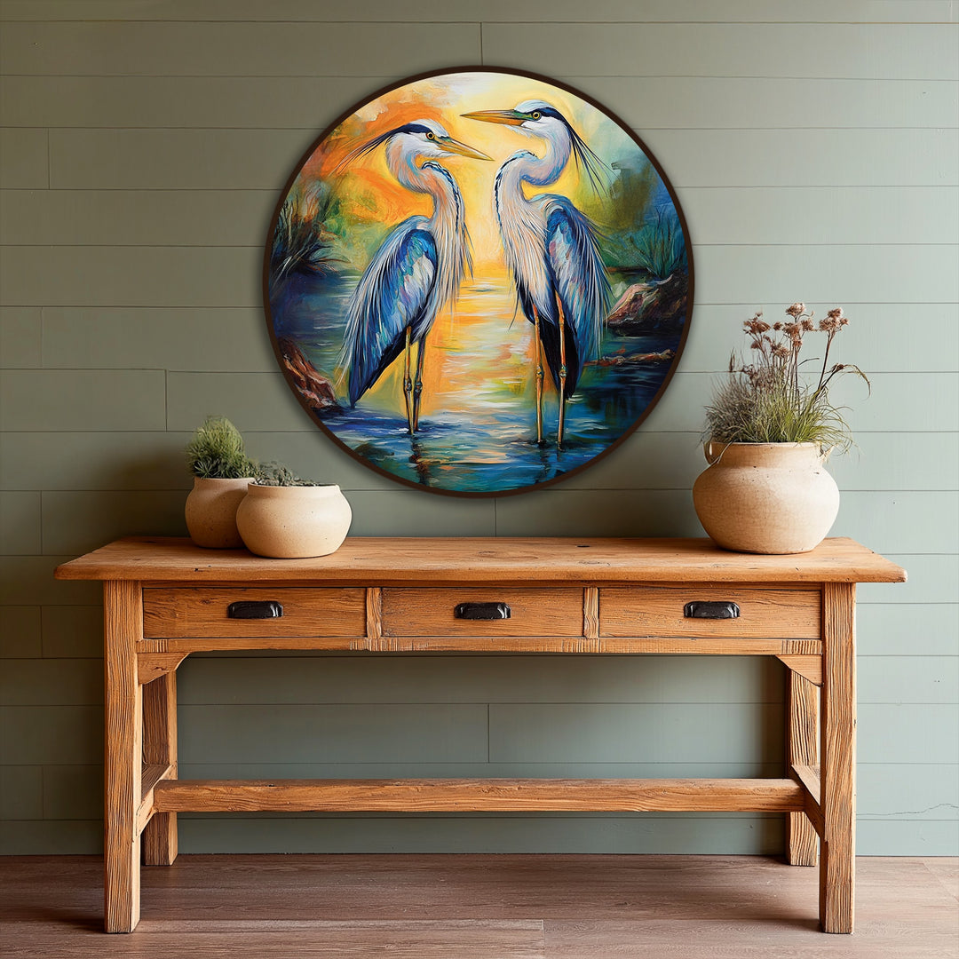 Framed by a rich, dark border, this circular Sunset Reflections oil painting decoration captures two graceful herons amidst a tranquil waterscape.