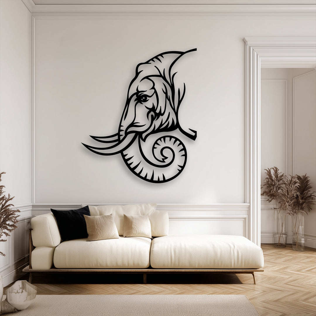 The majestic elephant line art metal art for wall casts striking shadows against the bright white wall, highlighting its intricate tribal design.