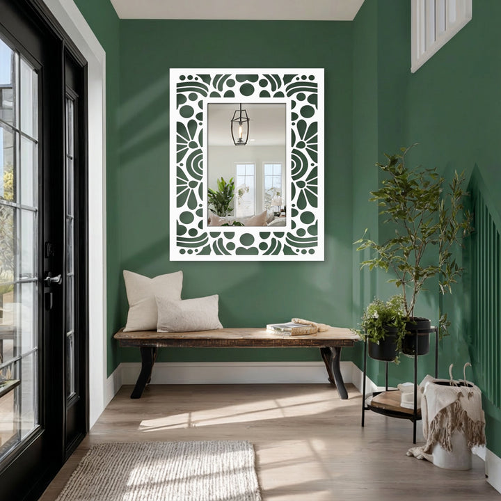 Dominant green hues complement the white floral frame of this rectangular decorative mirror, adding a touch of retro geometric charm to the scene.