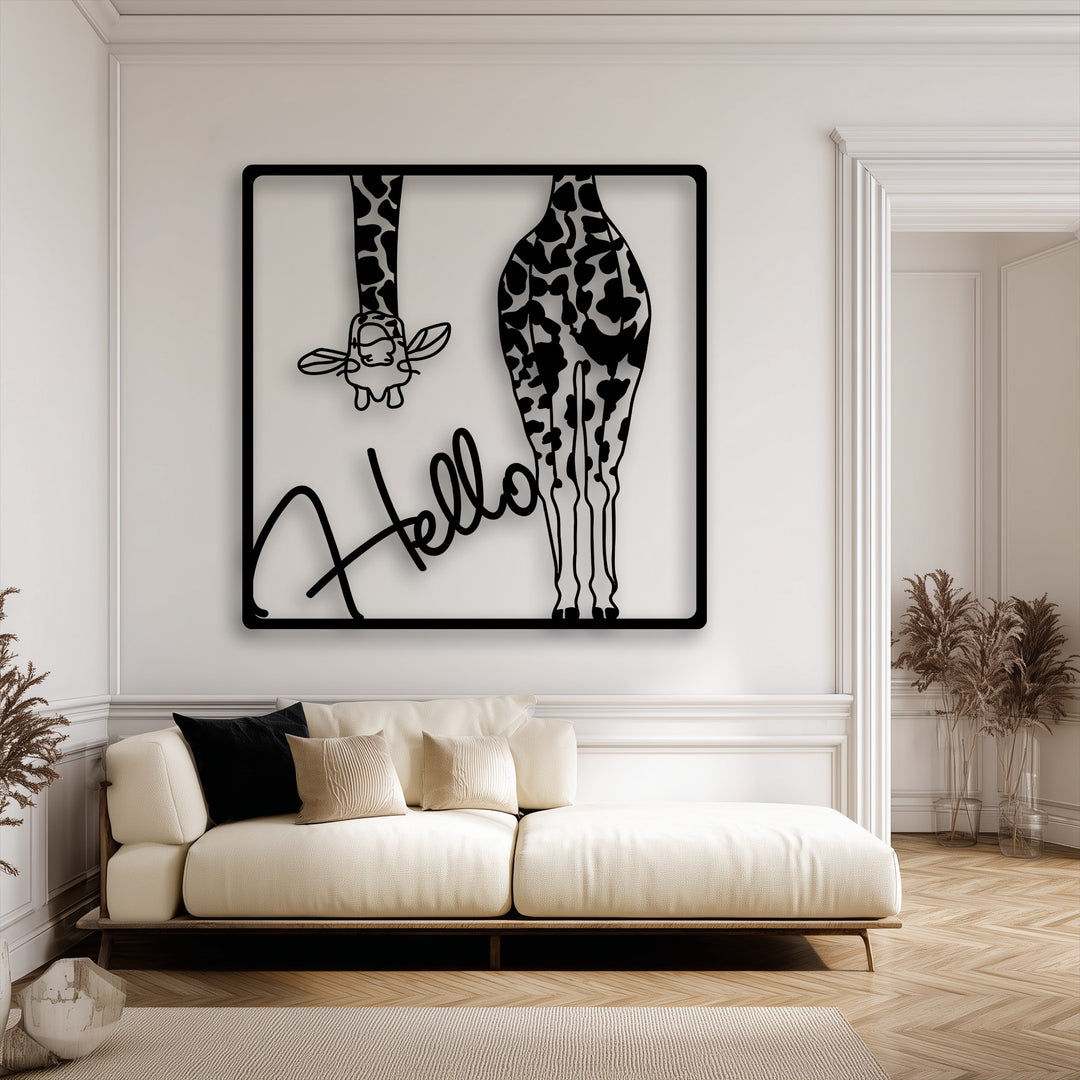The smooth surface texture of the black metal artwork depicting a playful giraffe contrasts with the soft fabric of the sofa and the ribbed rug.