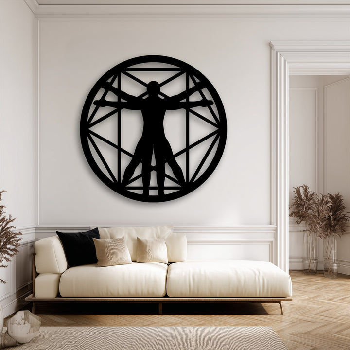 The distinct edges and borders of the Vitruvian Man geometric circle metal artwork are framed by elegant white wall molding.