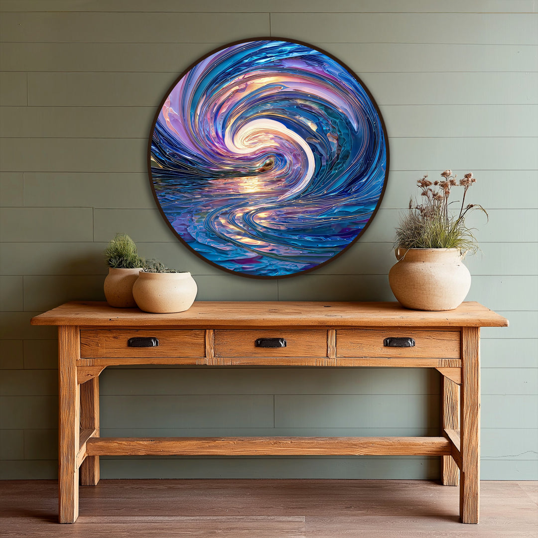 The focal point of this iridescent celestial tide round oil painting artwork captures swirling blues and violet hues in a modern abstract wave design.