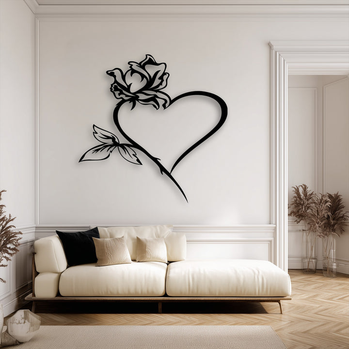 The realistic detail of the intricate rose heart metal wall decor is highlighted by its deep shadow, giving a striking dimensional effect.