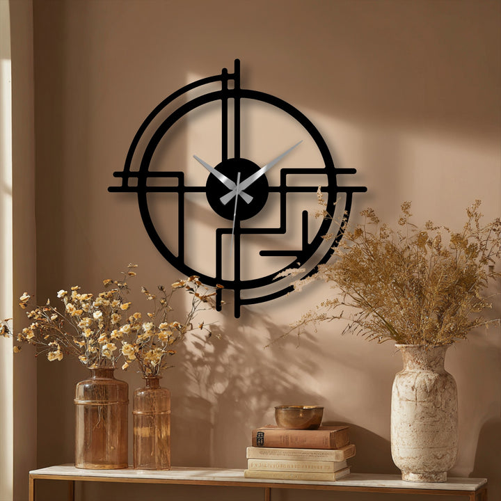 Warm color temperature highlights the black and silver of the modern abstract line metal wall clock, a unique metal wall art piece.