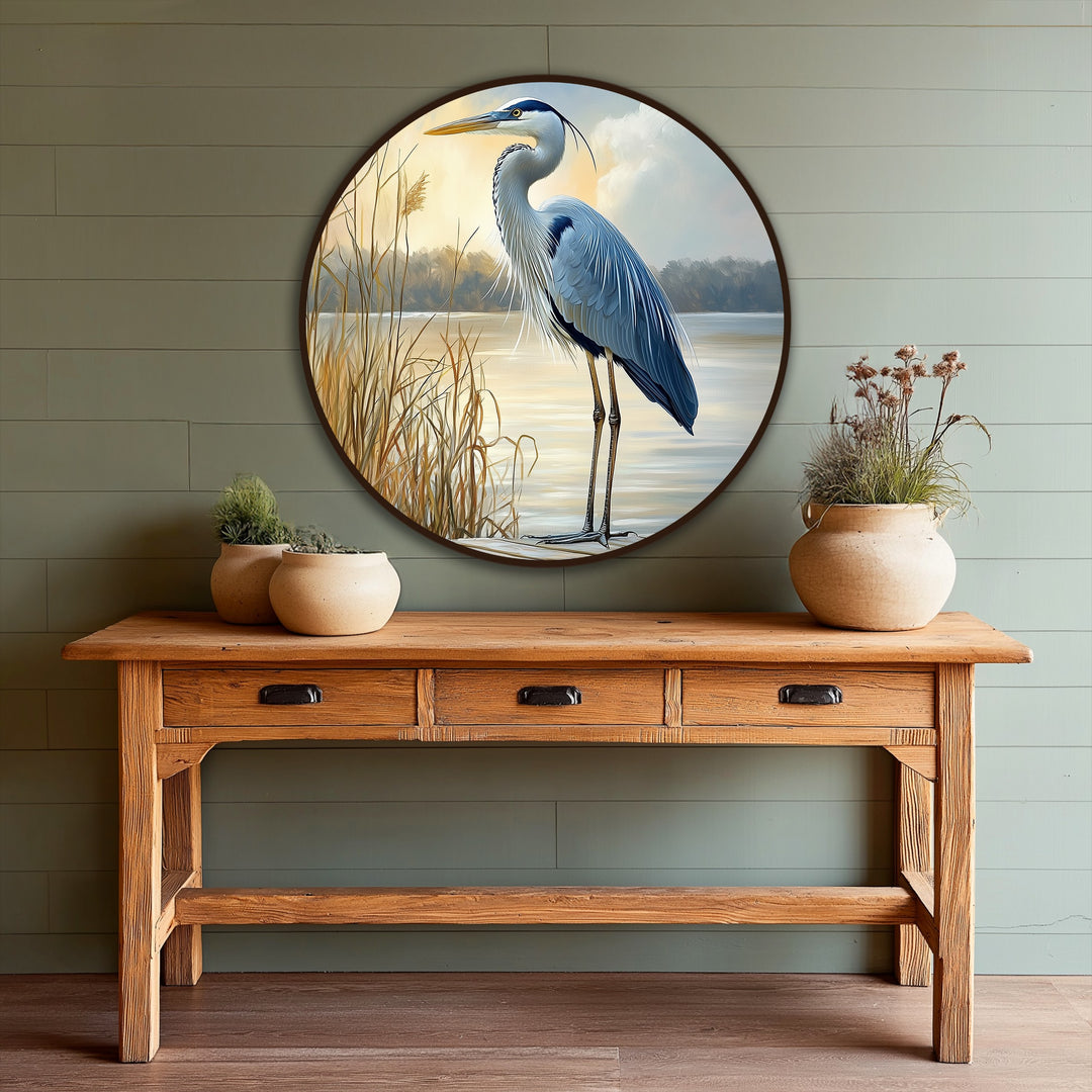 Layering effect highlighted by the still waters and tall grasses in this serene oil painting art piece of a majestic heron at sunrise, creating depth and dimension.