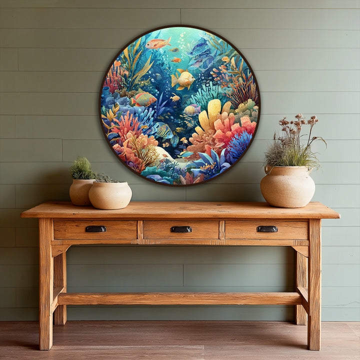 Predominantly vibrant, this underwater scene displays a round oil painting decoration featuring the lively colors of a coral reef and various tropical fish.