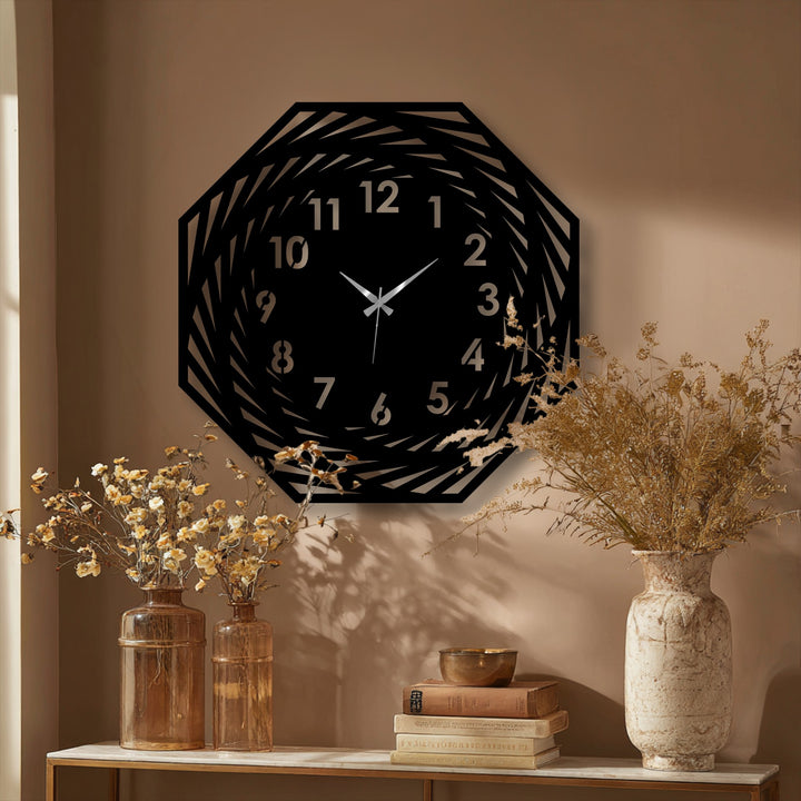 Textured metal shows a matte surface texture on this modern, spiral geometric metal wall clock, creating a distinctive, unique metal wall art piece.