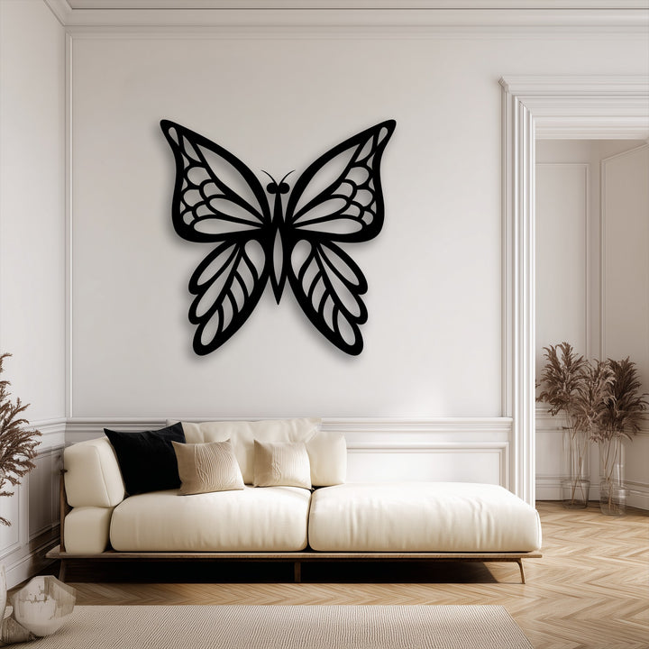 Visual rhythm is created by the intricate lines of the elegant butterfly silhouette, a stunning piece of metal wall decor.