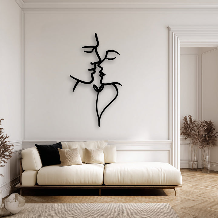 Soft light and subtle shadows outline the abstract face metal wall art, adding depth and visual interest as a unique decoration wall art piece.
