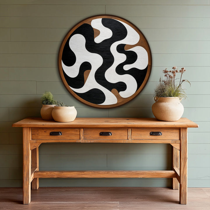 The oil painting artwork depicts a striking transition between black, white, and brown in a monochrome flow, abstract round form with fluid, organic shapes.