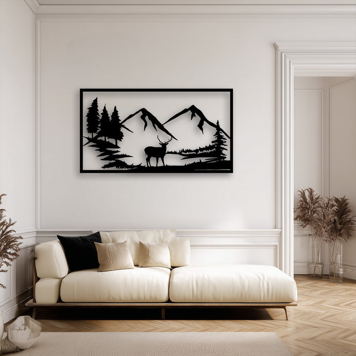 Soft shadows from the unique metal wall art of a majestic mountain deer silhouette and nature landscape gracefully contrast the bright wall.