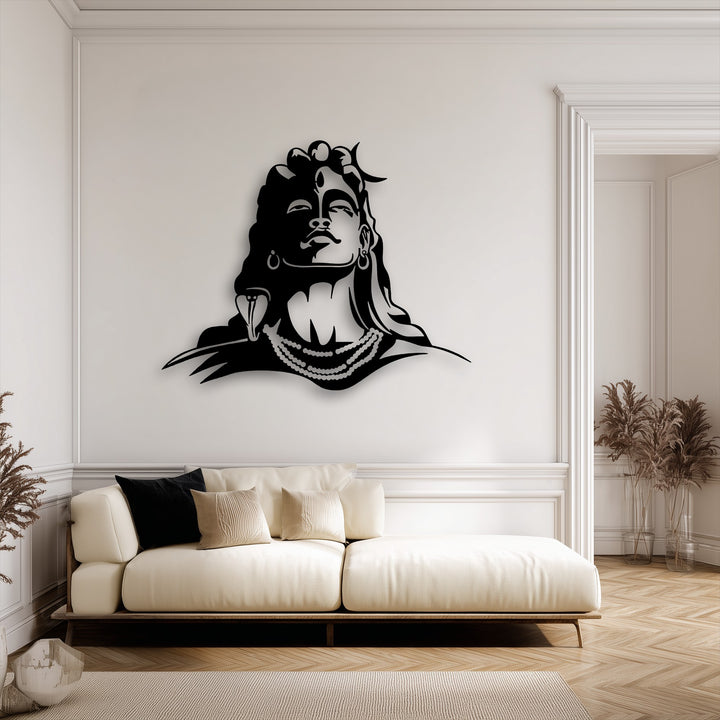 The stark transition from the deep black Lord Shiva decorative metal art silhouette to the warm off-white wall creates a visually striking contrast.