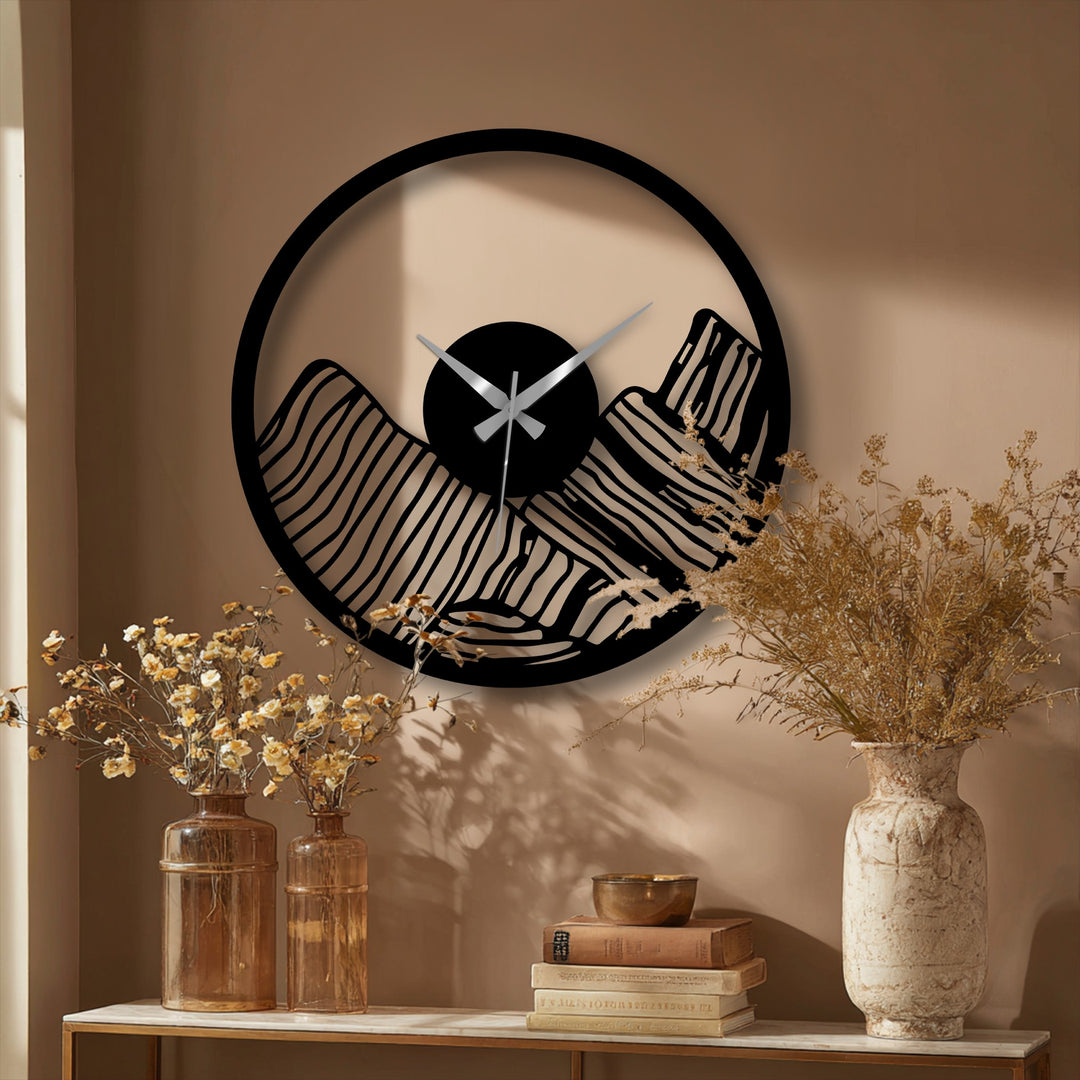 Warm color temperature emphasizes the modern canyon landscape metal wall decor, creating a cozy atmosphere with its contrasting black and metallic design.