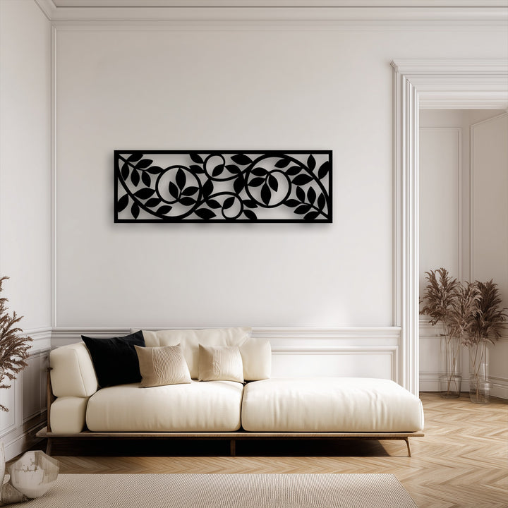 The darkest area showcases an intricate black flowing botanical vine pattern metal wall decor panel, providing a modern accent.